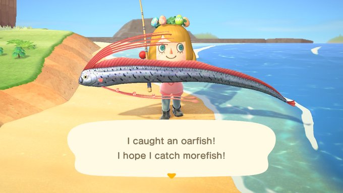 My character shows off a rare catch from fishing! The oarfish is worth 9,000 bells (the games currency).