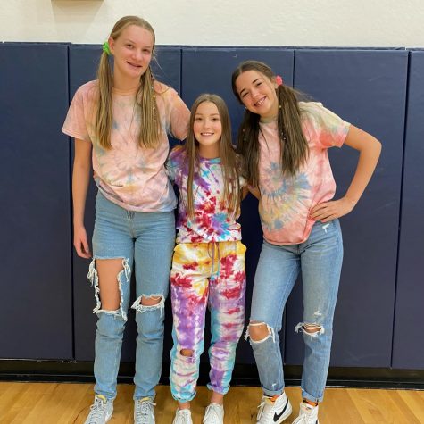 Corrie Anderson, Emily Klahn and Lacie Cook show off their tie dye outfits.